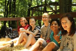 Sage (far right) and her friends on a hayride. Yep, she's having fun. Source: BRR