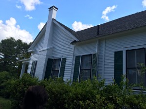 A new roof, and the finished painted left side of the house.
